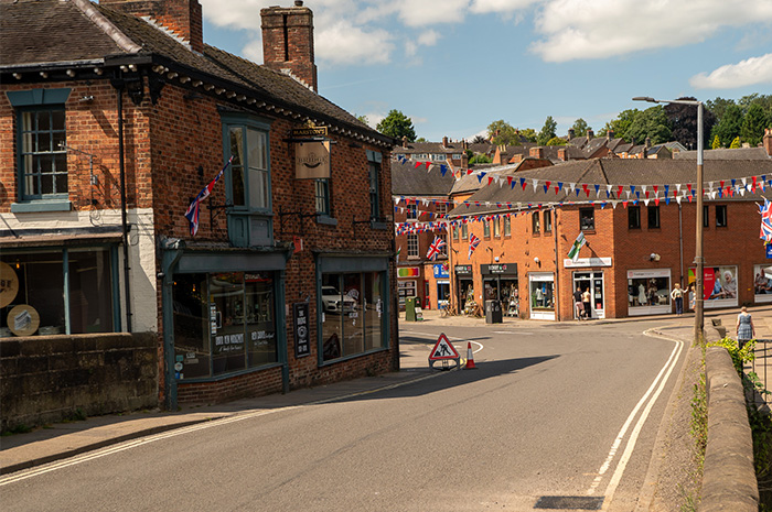 View along the road over Henmore Bridge towards Dig Street on a sunny day