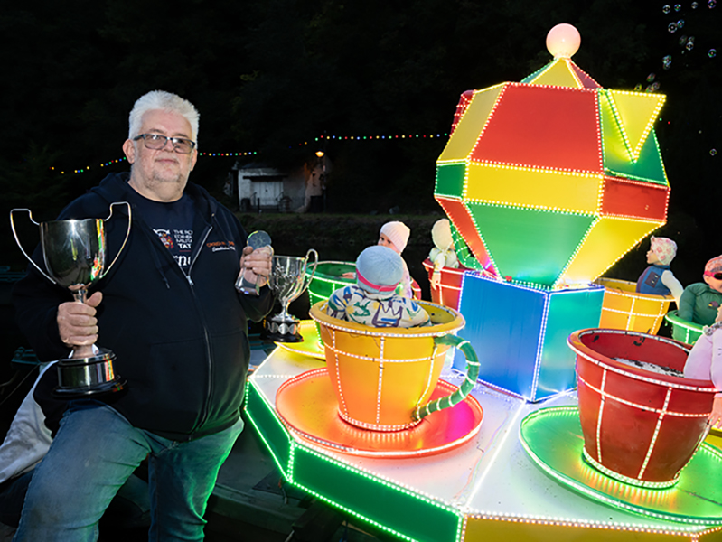 Boat winner David Harrison with his trophies and boat