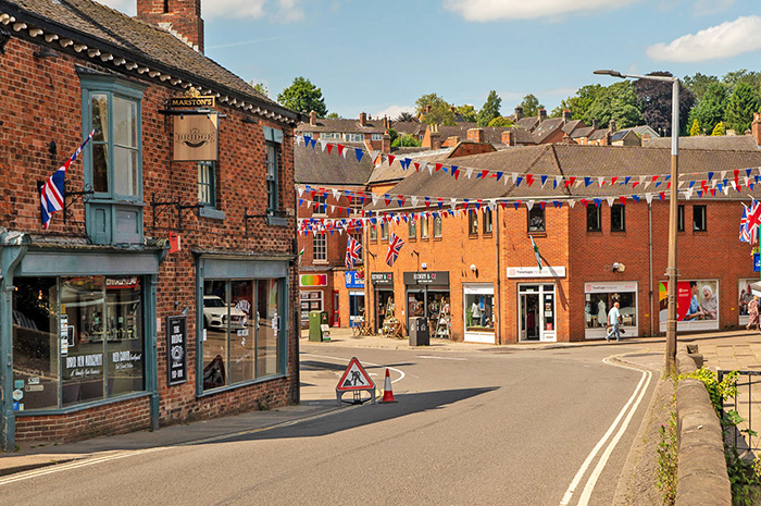 View along the road over Henmore Bridge towards Dig Street on a sunny day